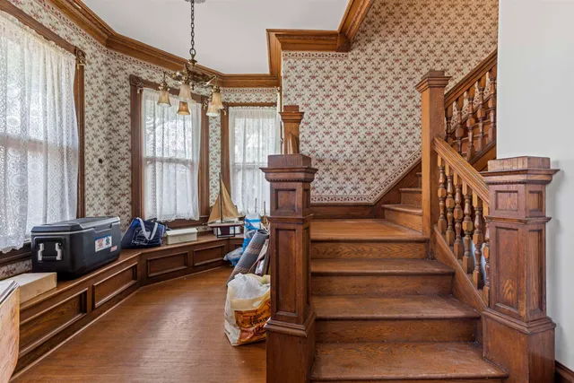 a view of entryway with pool and windows