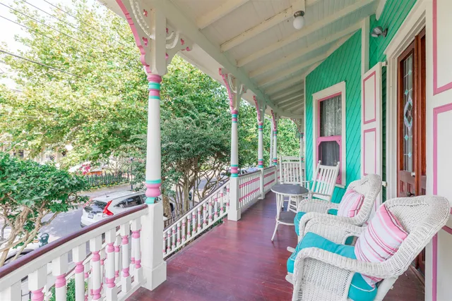 a balcony with furniture and garden view