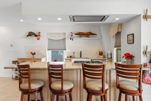 a dining room with wooden floor and breakfast area