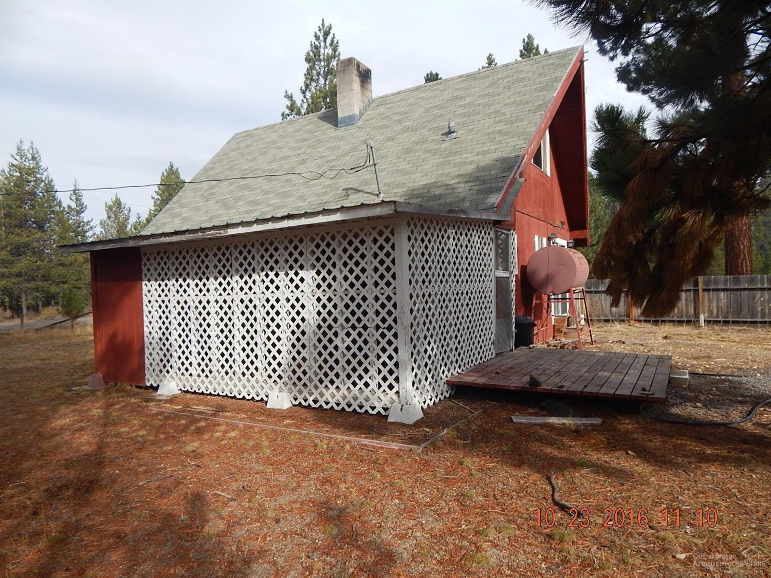 147117 Gracies Road Gilchrist, OR 97737 - Photo 6 of 22 South side of home. Back deck goes to s
