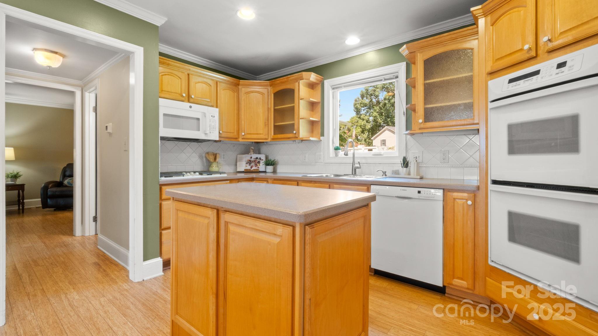 8809 Fairview Road Mint Hill, NC 28227 - Photo 11 of 43 a kitchen with a sink stove and a refrigerator