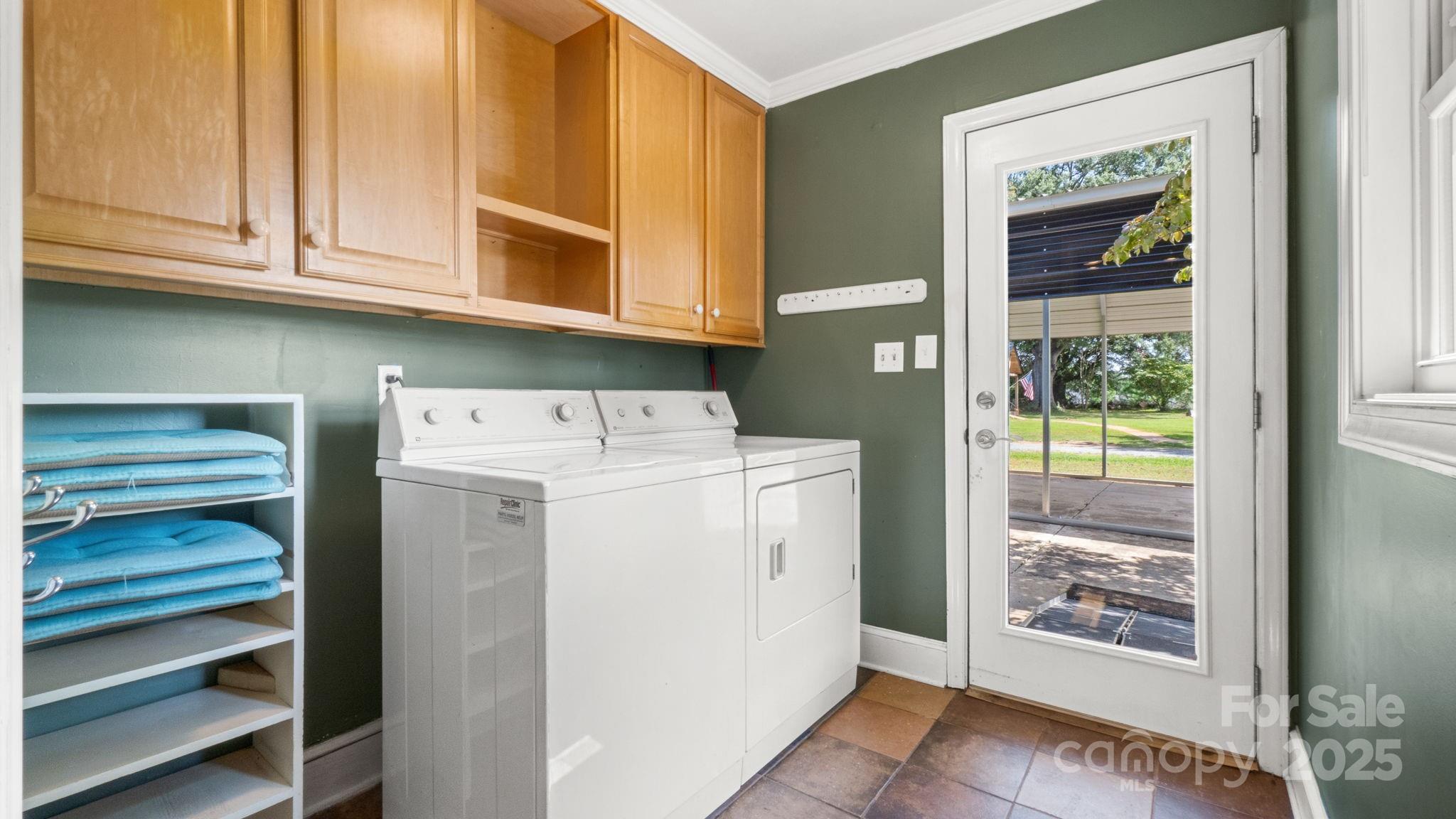 8809 Fairview Road Mint Hill, NC 28227 - Photo 18 of 43 a utility room with dryer and washer
