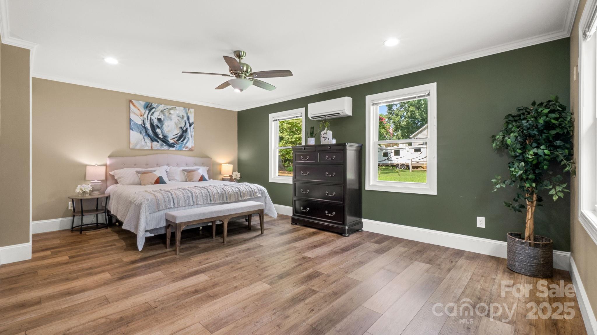 8809 Fairview Road Mint Hill, NC 28227 - Photo 20 of 43 a spacious bedroom with a bed and a window