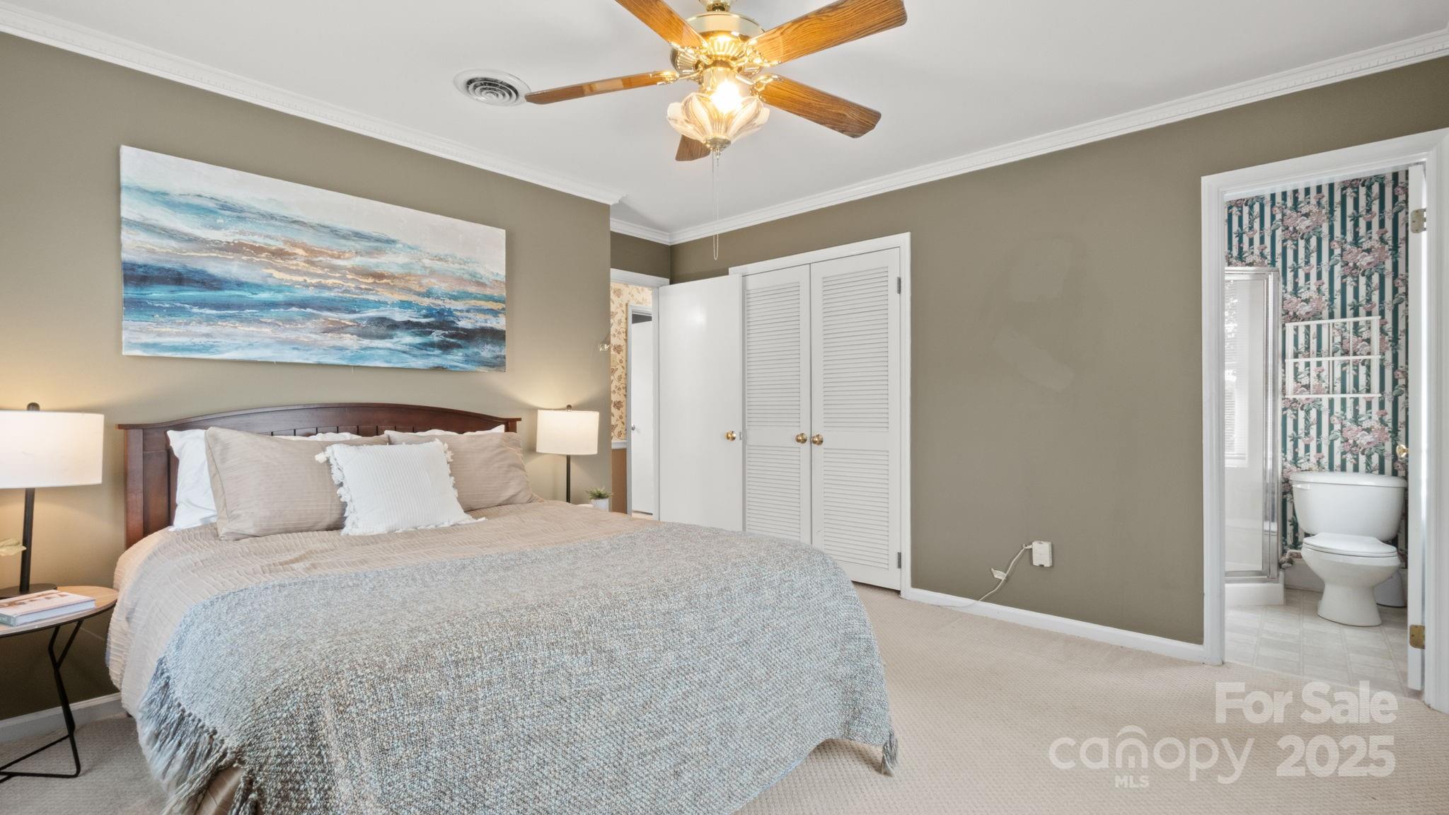 8809 Fairview Road Mint Hill, NC 28227 - Photo 25 of 43 a bedroom with a bed and a painting on the wall