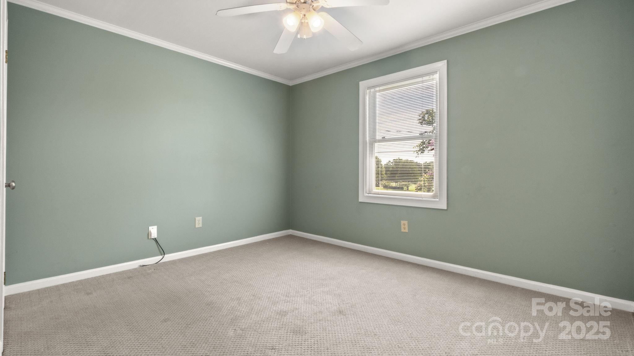 8809 Fairview Road Mint Hill, NC 28227 - Photo 29 of 43 a view of an empty room with a window