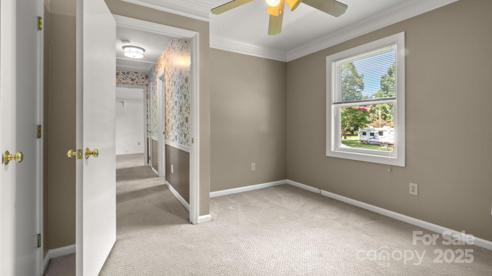 8809 Fairview Road Mint Hill, NC 28227 - Photo 31 of 43 an empty room that has a window and wooden floor