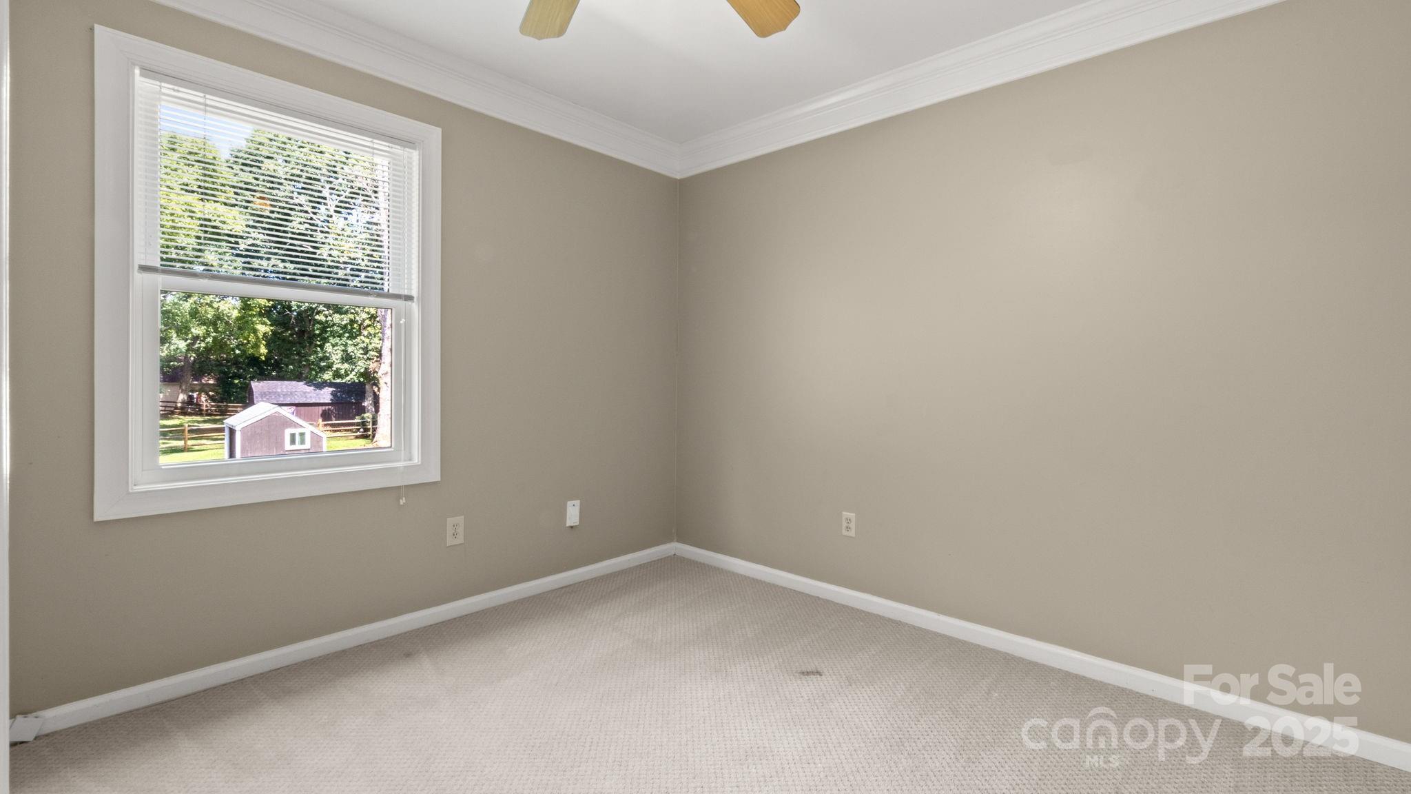 8809 Fairview Road Mint Hill, NC 28227 - Photo 32 of 43 an empty room with a window