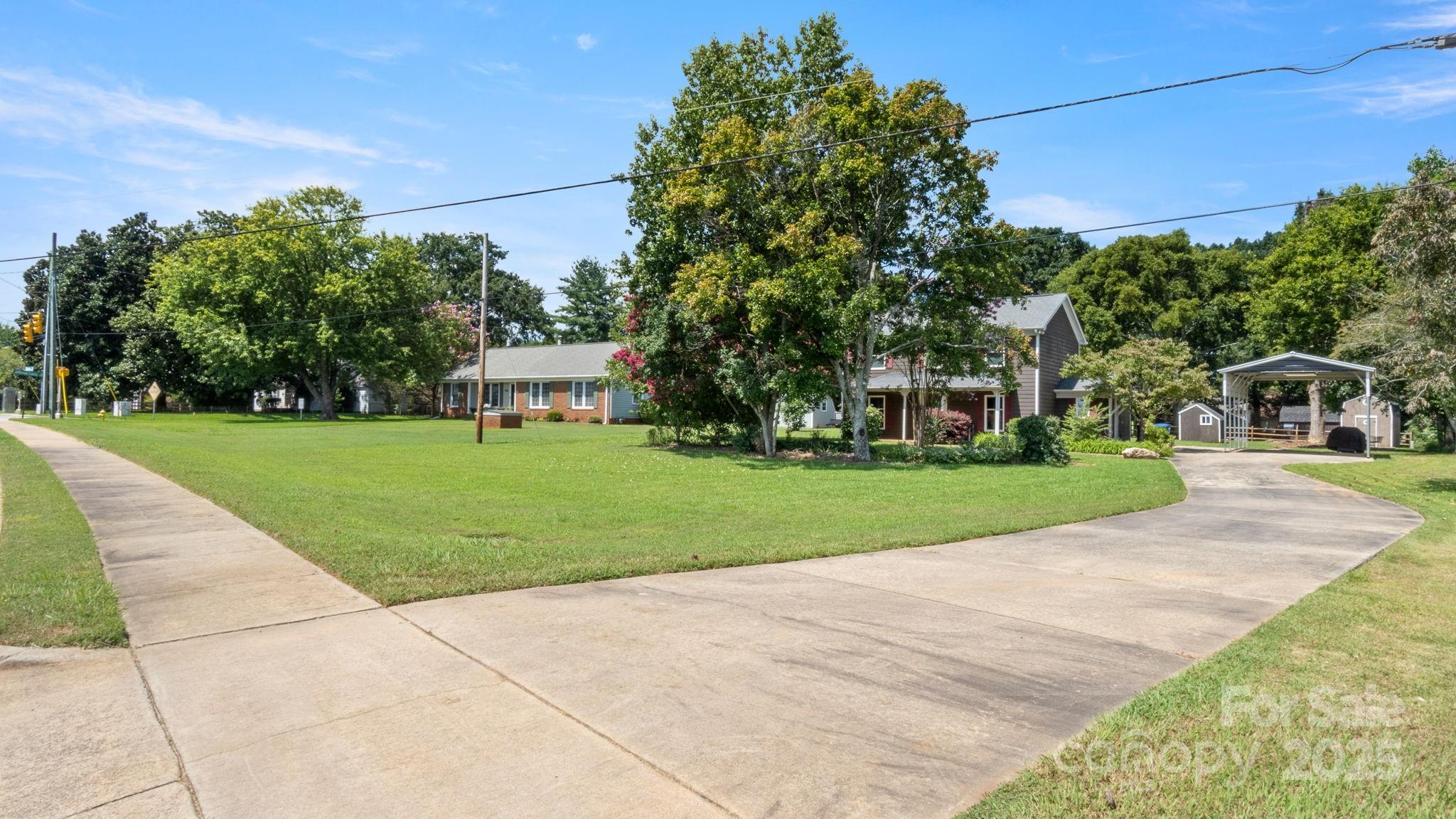 8809 Fairview Road Mint Hill, NC 28227 - Photo 34 of 43 a front view of a house with a yard