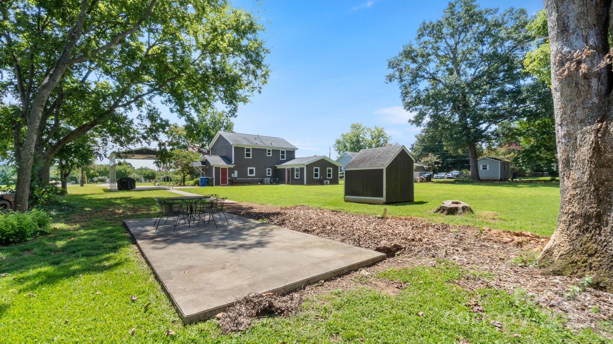 8809 Fairview Road Mint Hill, NC 28227 - Photo 37 of 43 a view of a house with a yard