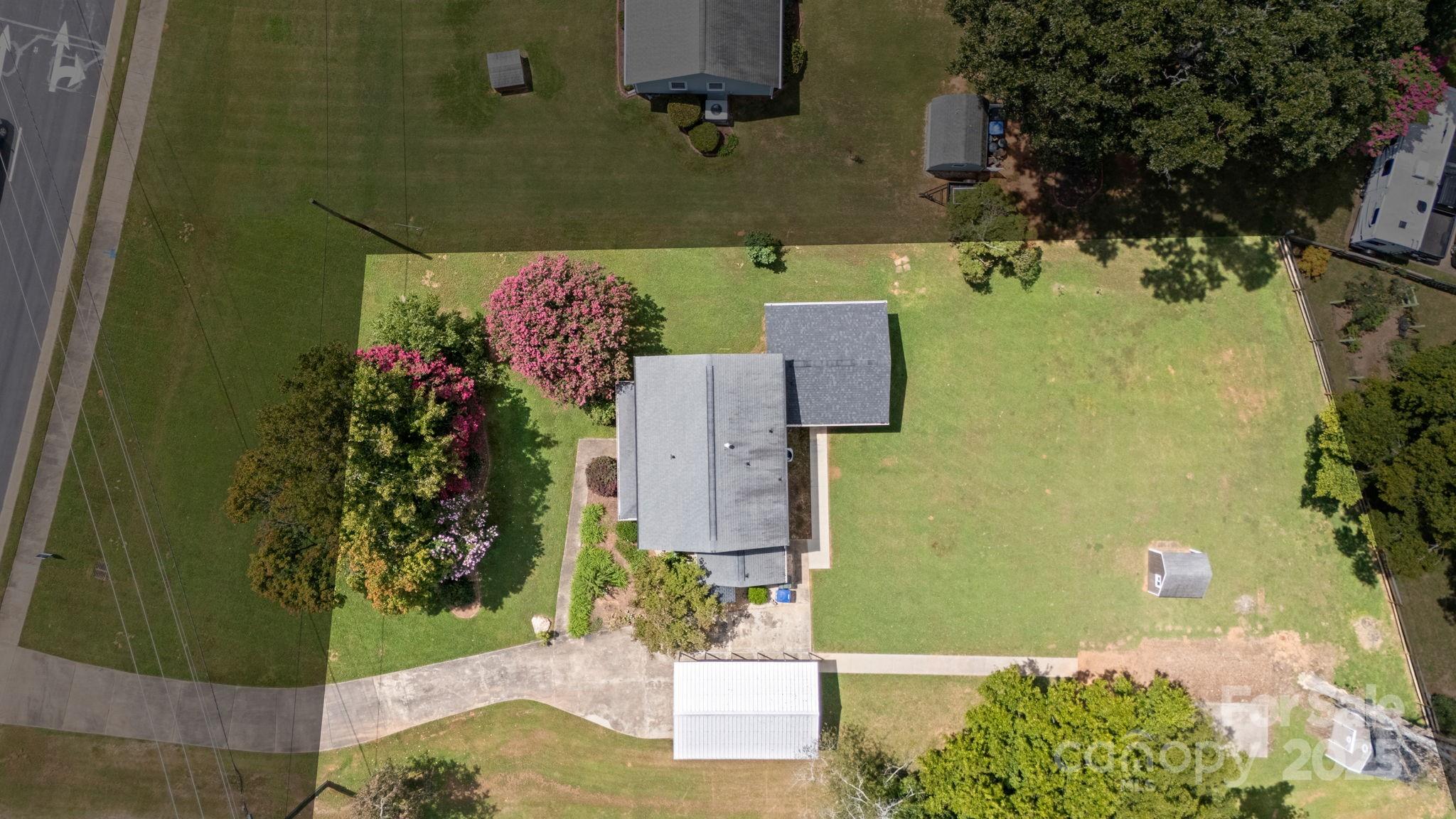 8809 Fairview Road Mint Hill, NC 28227 - Photo 40 of 43 an aerial view of a house with a yard