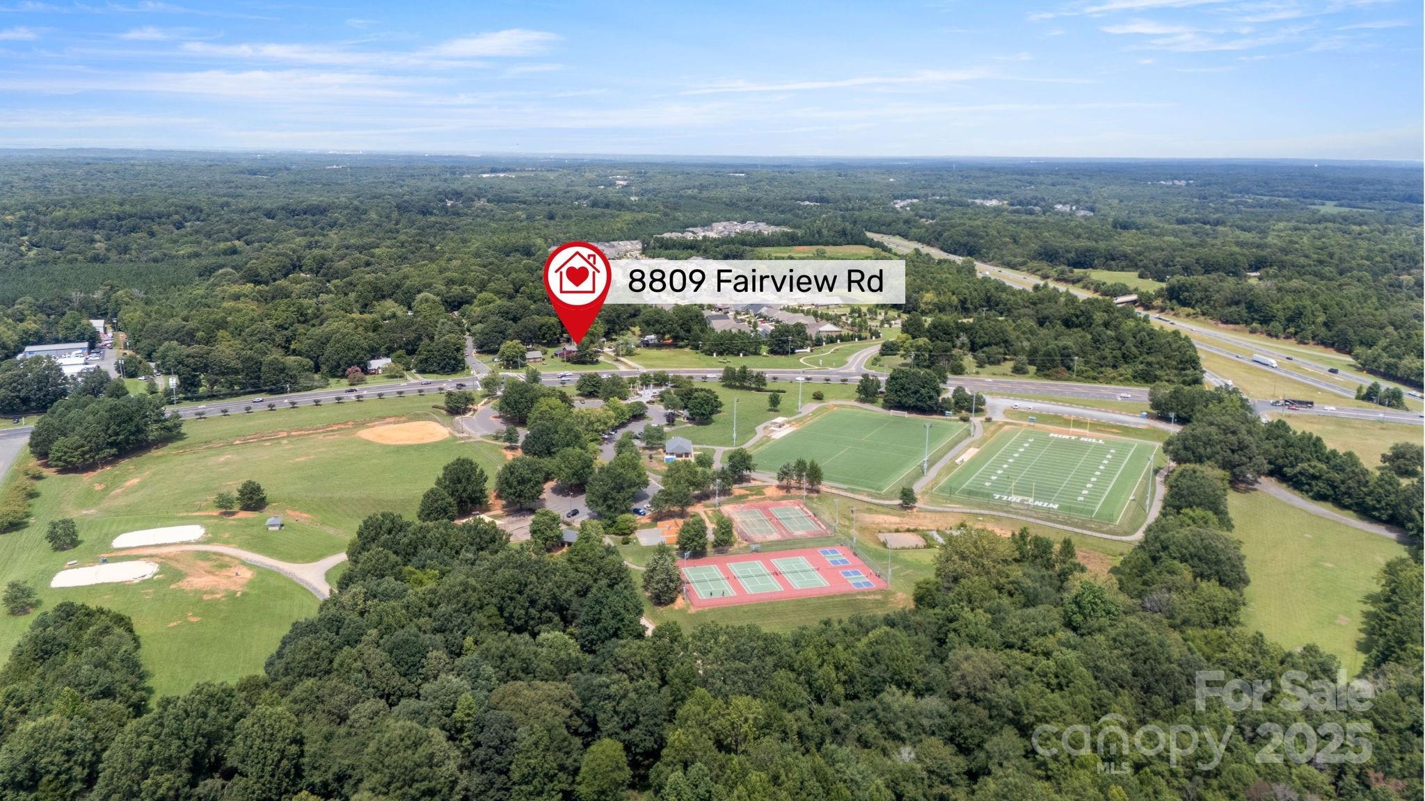8809 Fairview Road Mint Hill, NC 28227 - Photo 43 of 43 an aerial view of a house with a garden