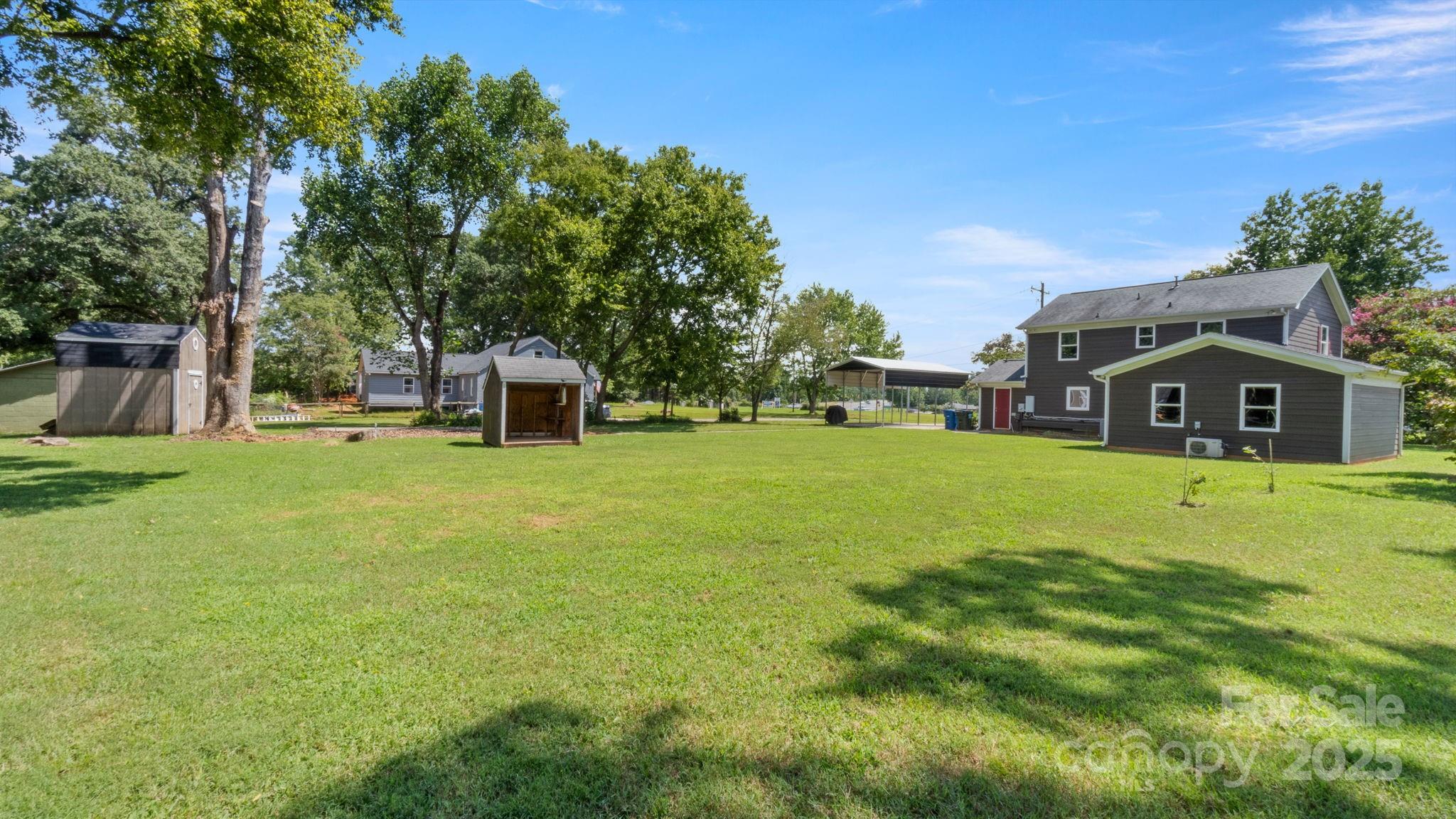 8809 Fairview Road Mint Hill, NC 28227 - Photo 5 of 43 a view of a house with a big yard