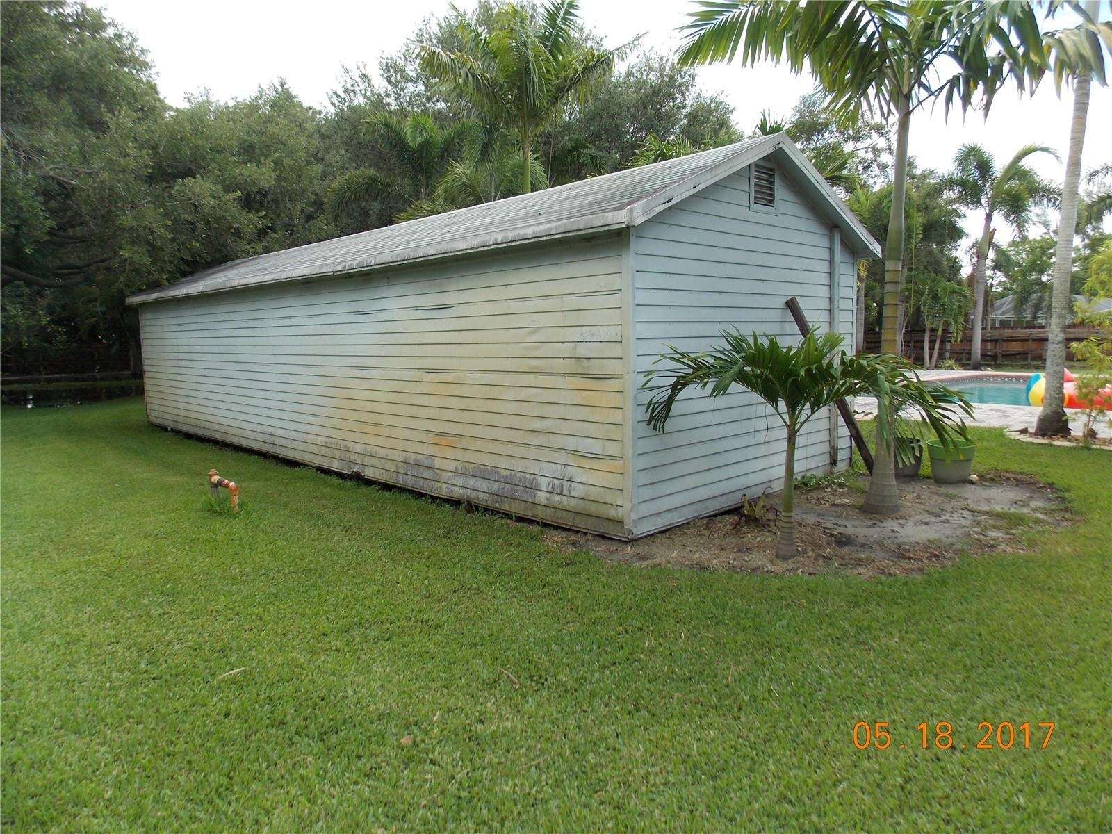 18521 Southwest 55th Street Southwest Ranches, FL 33332 - Photo 14 of 17 a view of a backyard with a garden