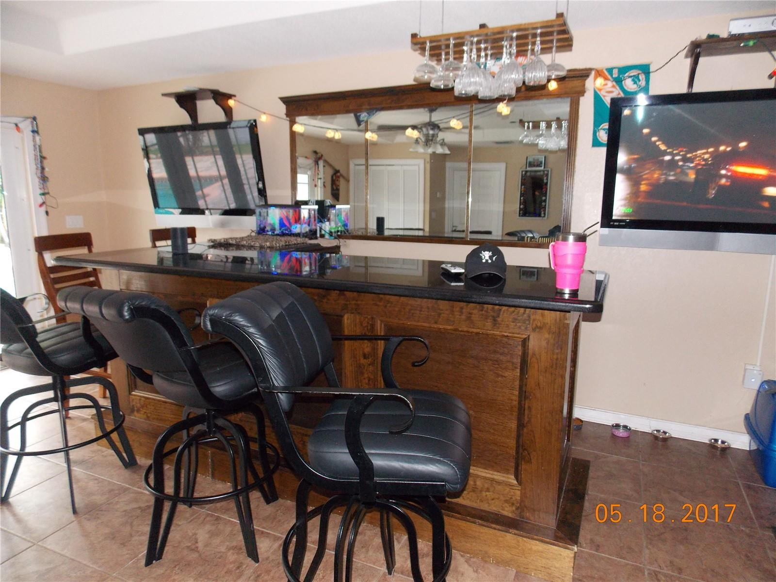 18521 Southwest 55th Street Southwest Ranches, FL 33332 - Photo 2 of 17 a room with furniture and a flat screen tv