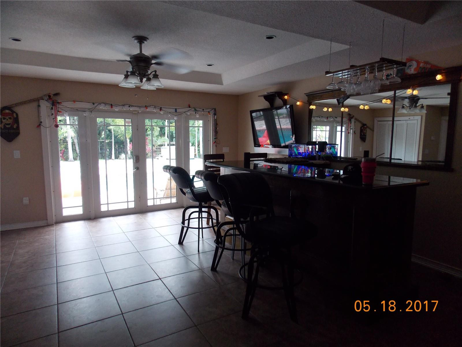 18521 Southwest 55th Street Southwest Ranches, FL 33332 - Photo 6 of 17 a view of a dining room with furniture window and outside view