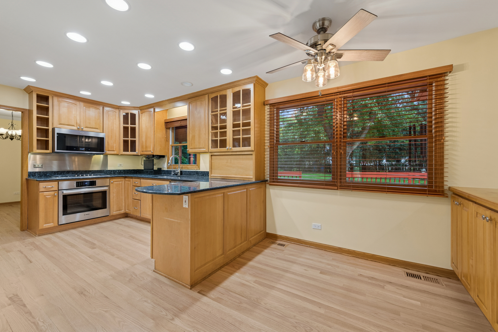226 Aberdeen Road Cary, IL 60013 - Photo 11 of 40 a kitchen with stainless steel appliances granite countertop a stove top oven a sink and a refrigerator