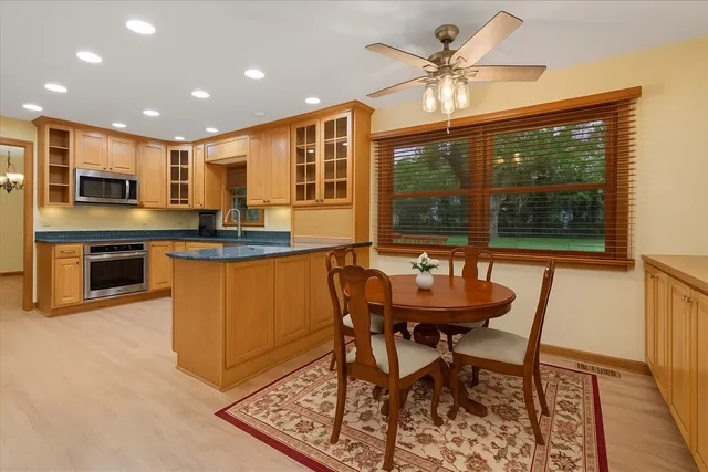 a dining room with furniture and window