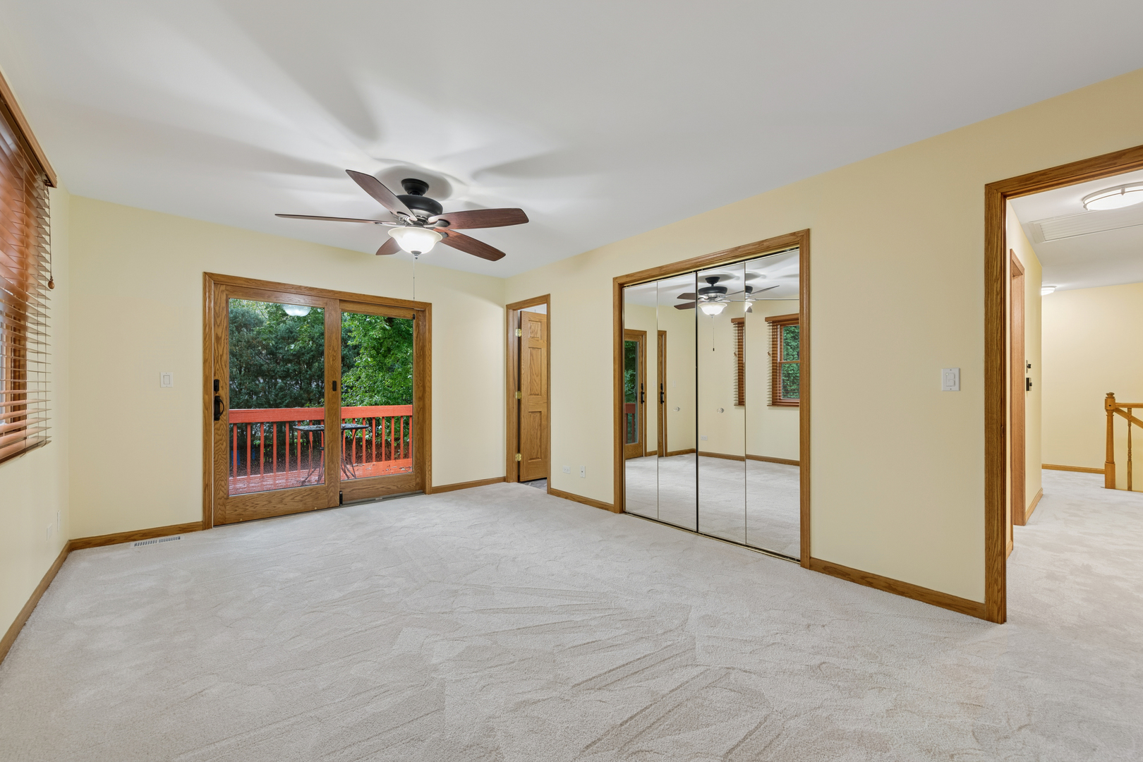 226 Aberdeen Road Cary, IL 60013 - Photo 18 of 40 an empty room with chandelier fan and windows