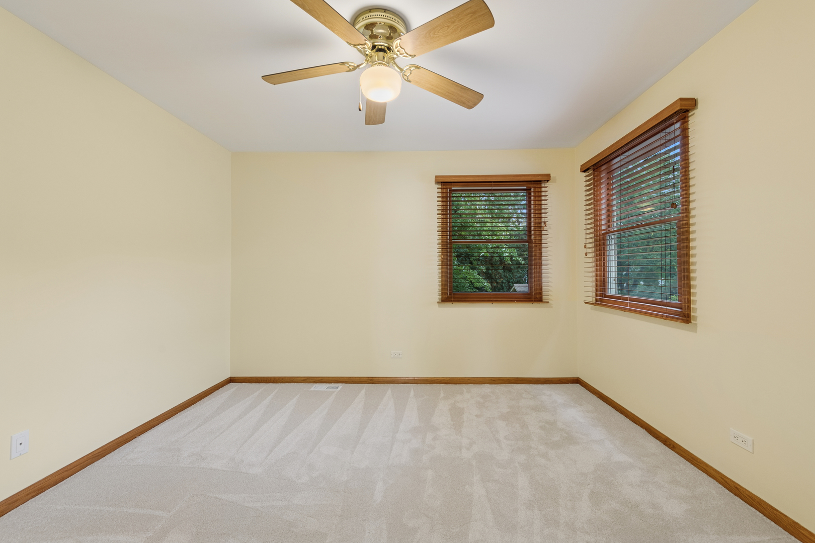 226 Aberdeen Road Cary, IL 60013 - Photo 21 of 40 an empty room with a window and a fan