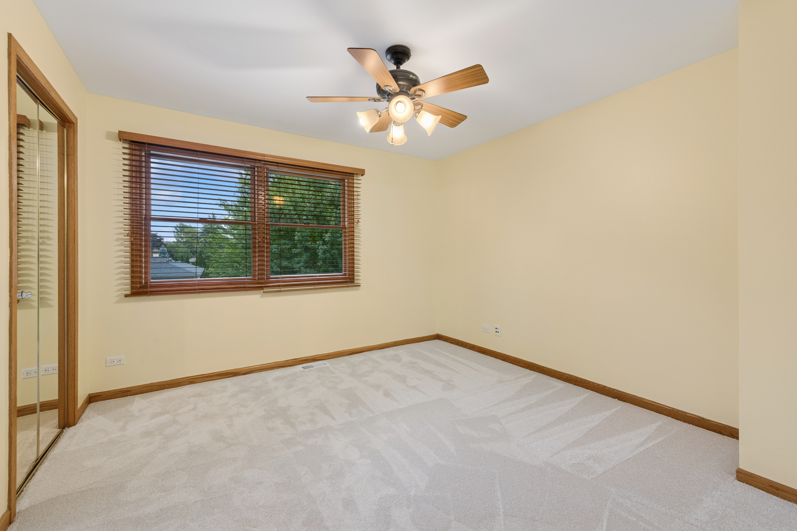 226 Aberdeen Road Cary, IL 60013 - Photo 22 of 40 an empty room with window and ceiling fan