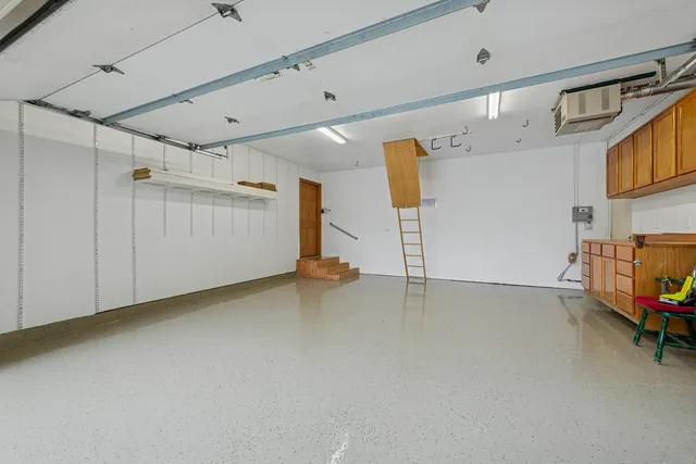 a view of a storage & utility room with two washing machine