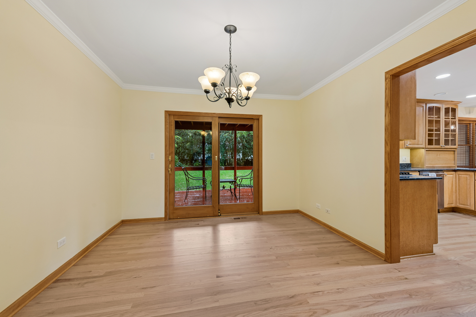 226 Aberdeen Road Cary, IL 60013 - Photo 6 of 40 a view of an empty room with wooden floor and a window