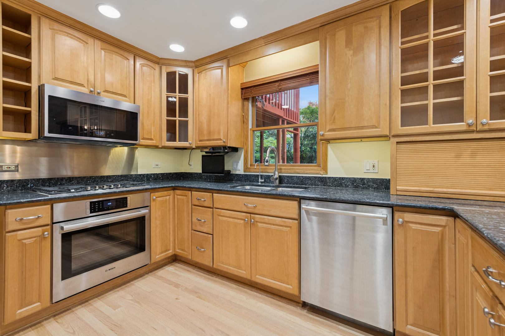 226 Aberdeen Road Cary, IL 60013 - Photo 9 of 40 a kitchen with stainless steel appliances granite countertop a stove a sink and a microwave