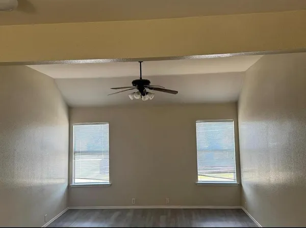 a view of an empty room with a window