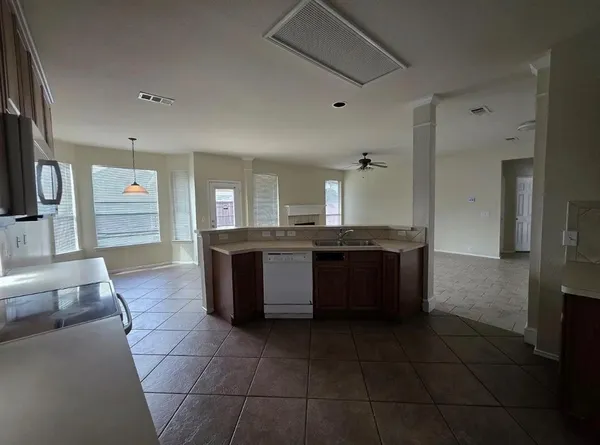 a large bathroom with a granite countertop tub a double vanity sink and mirror