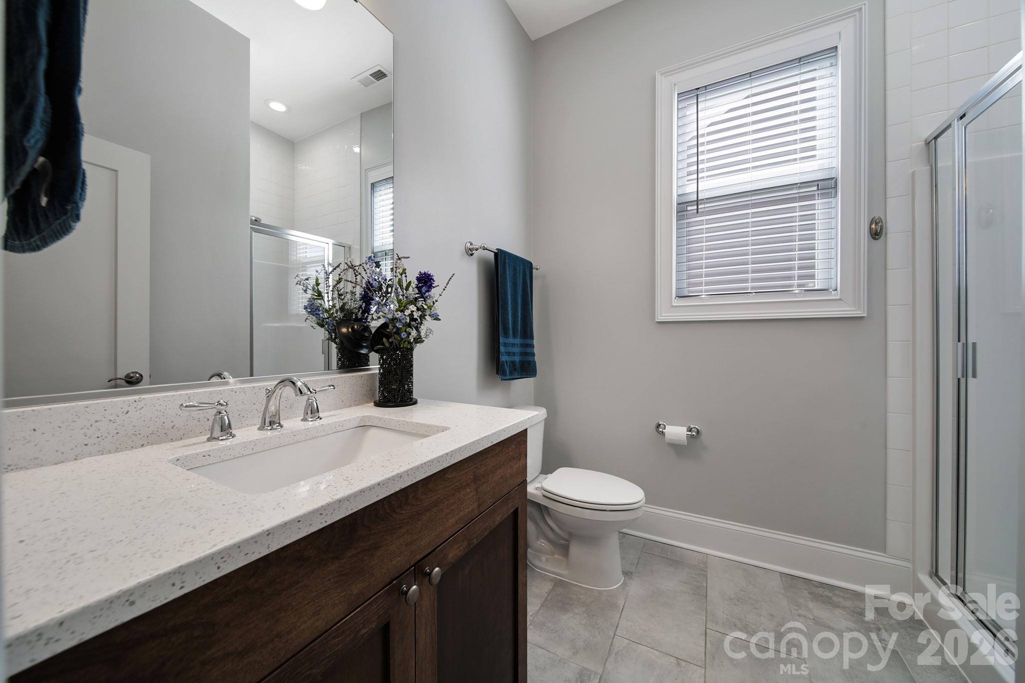 1633 Half Pint Loop Fort Mill, SC 29708 - Photo 6 of 48 a bathroom with a sink a toilet and mirror