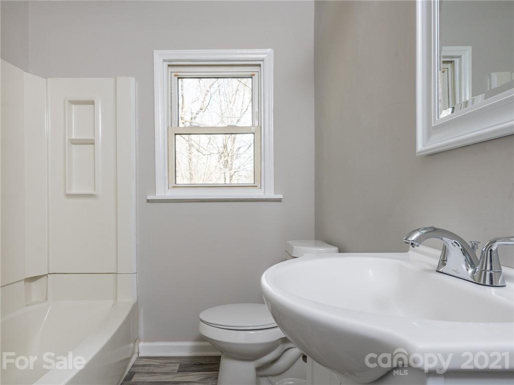 502 Davis Park Road Gastonia, NC 28052 - Photo 15 of 20 a white bath tub sitting next to a white toilet