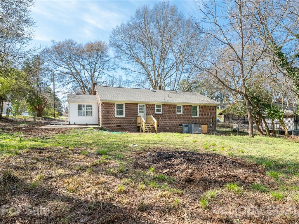 502 Davis Park Road Gastonia, NC 28052 - Photo 18 of 20 a view of a yard with a house and garden