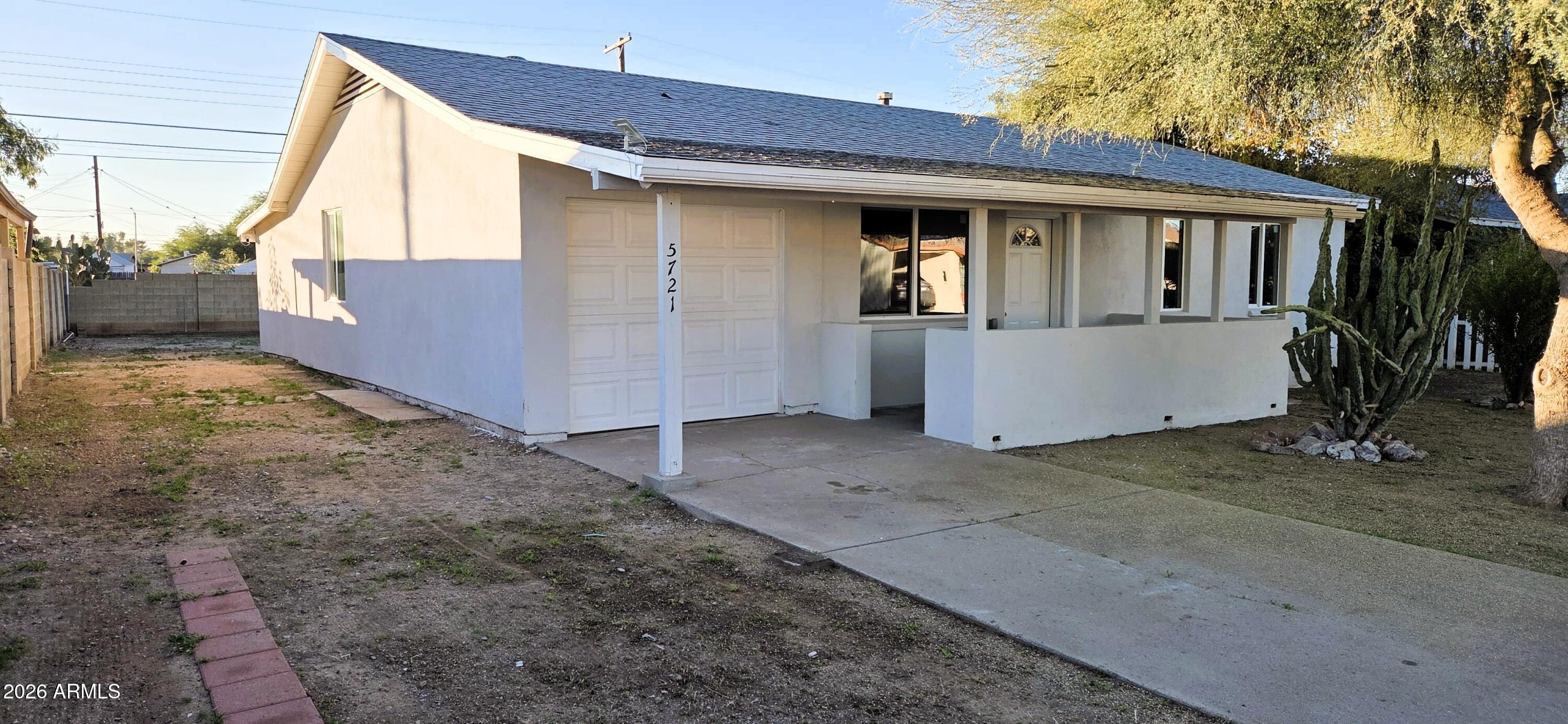 5721 West Cheery Lynn Road Phoenix, AZ 85031 - Photo 2 of 20 a view of a small house with roof deck