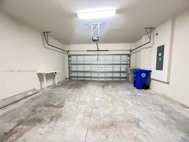 a view of a room with a cabinet and mirrors