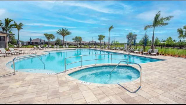 a view of a swimming pool with a lounge chair
