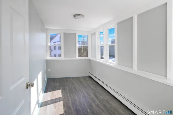 a view of an empty room with a window