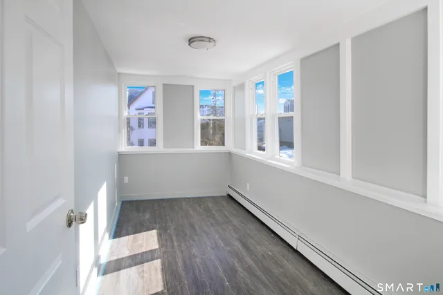 a view of an empty room with a window