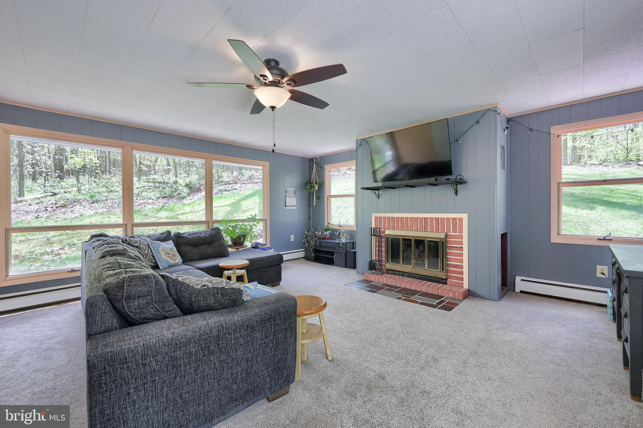 432 Vinemont Road Reading, PA 19608 - Photo 6 of 39 Family room with wood burning fireplace