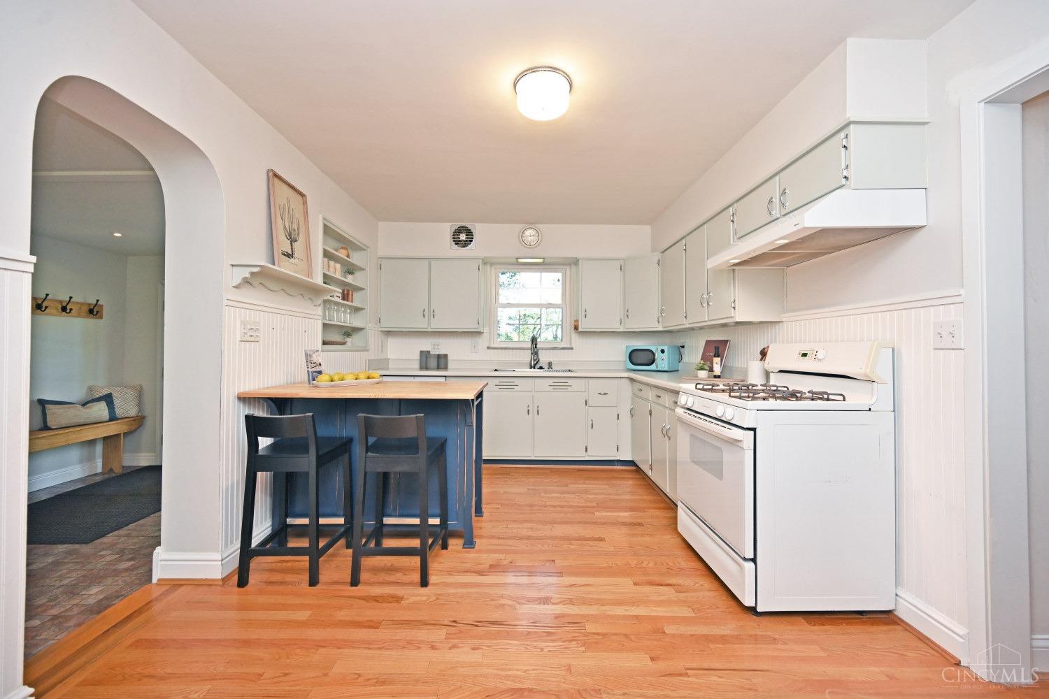 7083 Paddison Road Cincinnati, OH 45230 - Photo 4 of 78 The Heart of the home sets the 14 x 11 Kitchen. features hardwood floor, an island and built in spice rack.