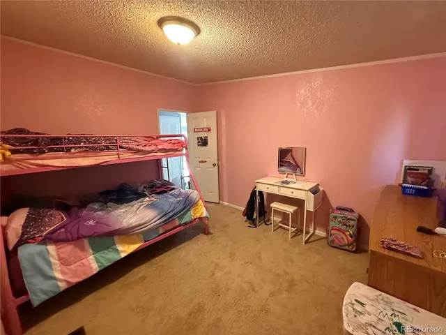 a bedroom with a bed and a mirror