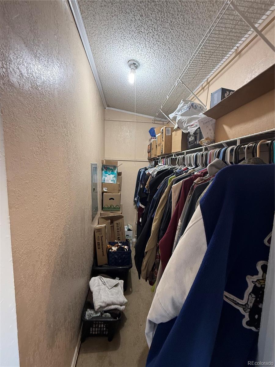 3439 West 3rd Street Road Greeley, CO 80631 - Photo 16 of 31 a view of walk in closet with clothes and shoes