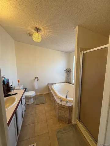 a bathroom with a tub and a sink