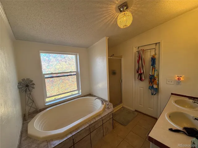 a kitchen with stainless steel appliances a stove a sink and a refrigerator