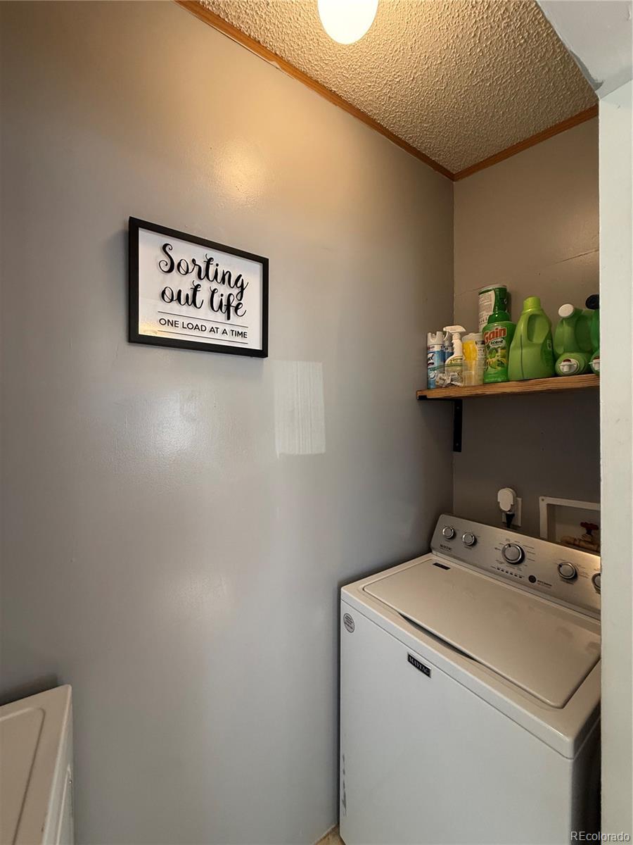 3439 West 3rd Street Road Greeley, CO 80631 - Photo 23 of 31 a utility room with dryer and washer