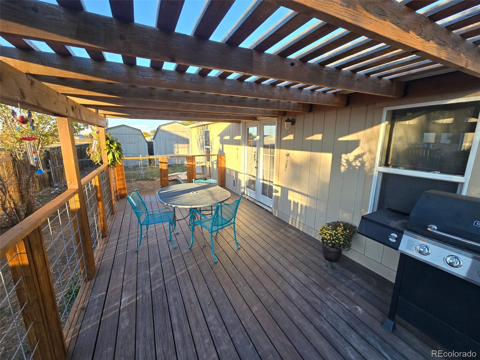 3439 West 3rd Street Road Greeley, CO 80631 - Photo 26 of 31 a dining room with furniture and wooden floor