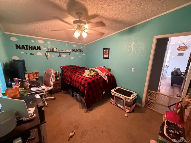 a bedroom with a bed and a lamp