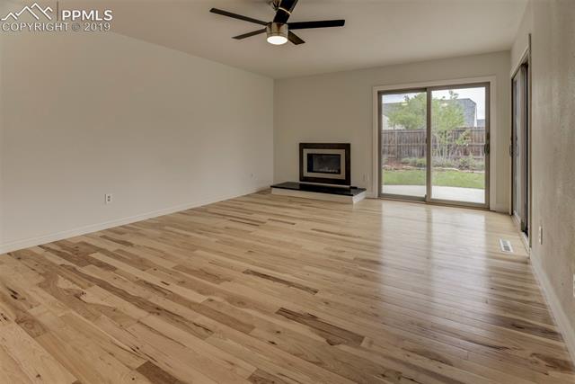620 Gilcrest Road Colorado Springs, CO 80906 - Photo 7 of 17 The ceiling fan will help keep you cool in the summer and the fireplace will keep you warm in the winter.