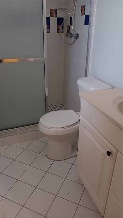 4169 Southwest 67th Avenue, Unit 209A Davie, FL 33314 - Photo 12 of 18 a white toilet sitting next to a bathroom sink