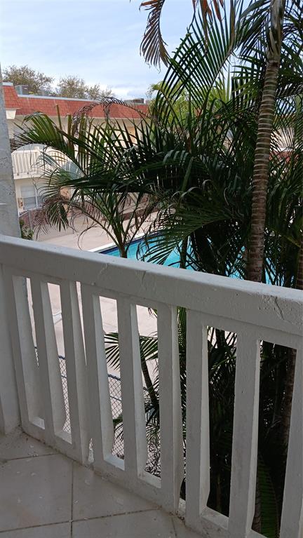 4169 Southwest 67th Avenue, Unit 209A Davie, FL 33314 - Photo 15 of 18 a view of a pathway of a building