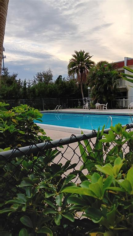 4169 Southwest 67th Avenue, Unit 209A Davie, FL 33314 - Photo 17 of 18 a view of a golf course with a lake